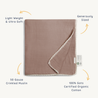 A square image showcasing a lightly textured, light brown Makemake Organics Organic Cotton Muslin Blanket in Pecan with a delicate natural lace trim and labeled as 50 gauge, ultra-soft, generously sized, and made from 100% organic cotton.