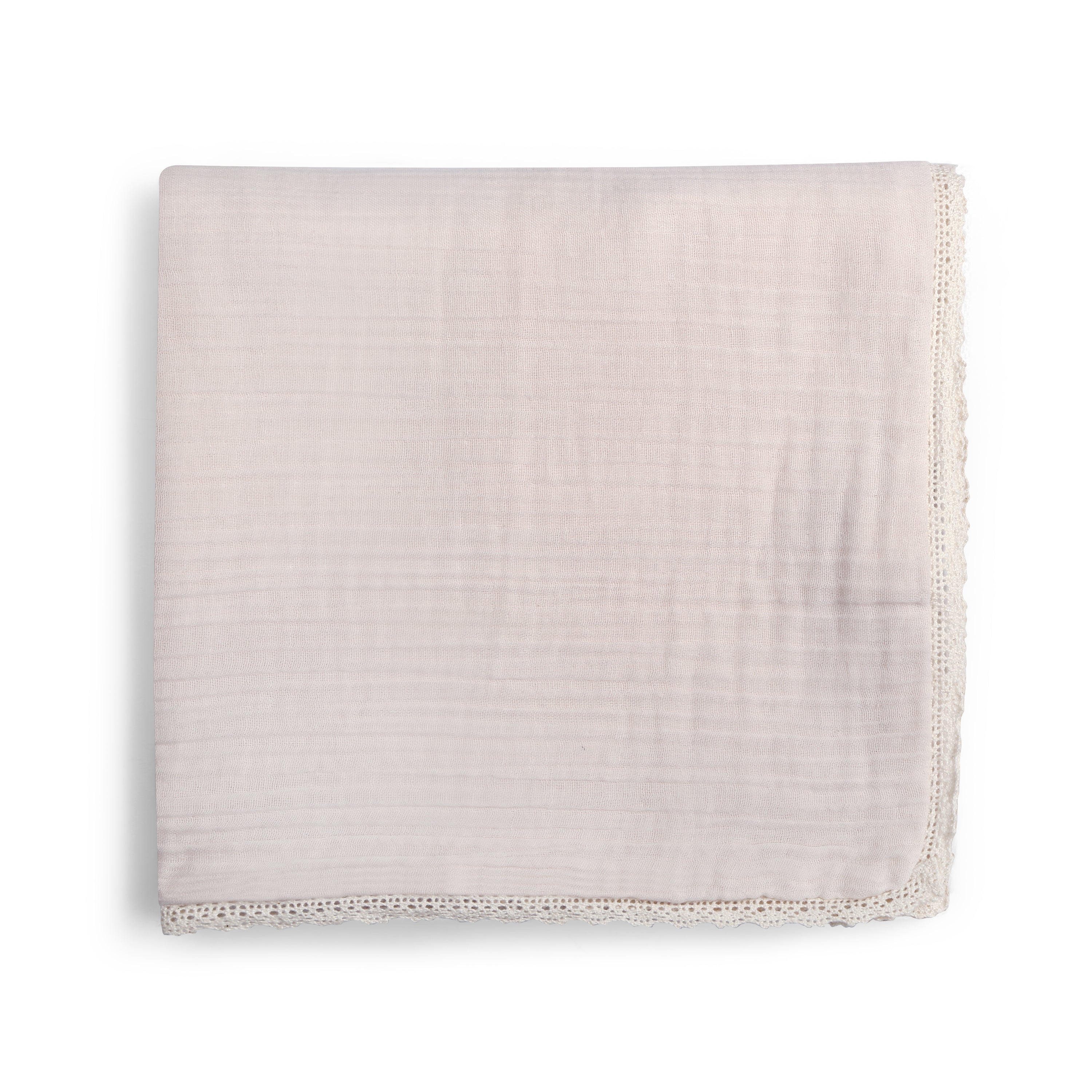 A single Organic Cotton Muslin Blanket in Blush Oat + Ivory Lace, neatly folded, displayed on a white background by Makemake Organics.