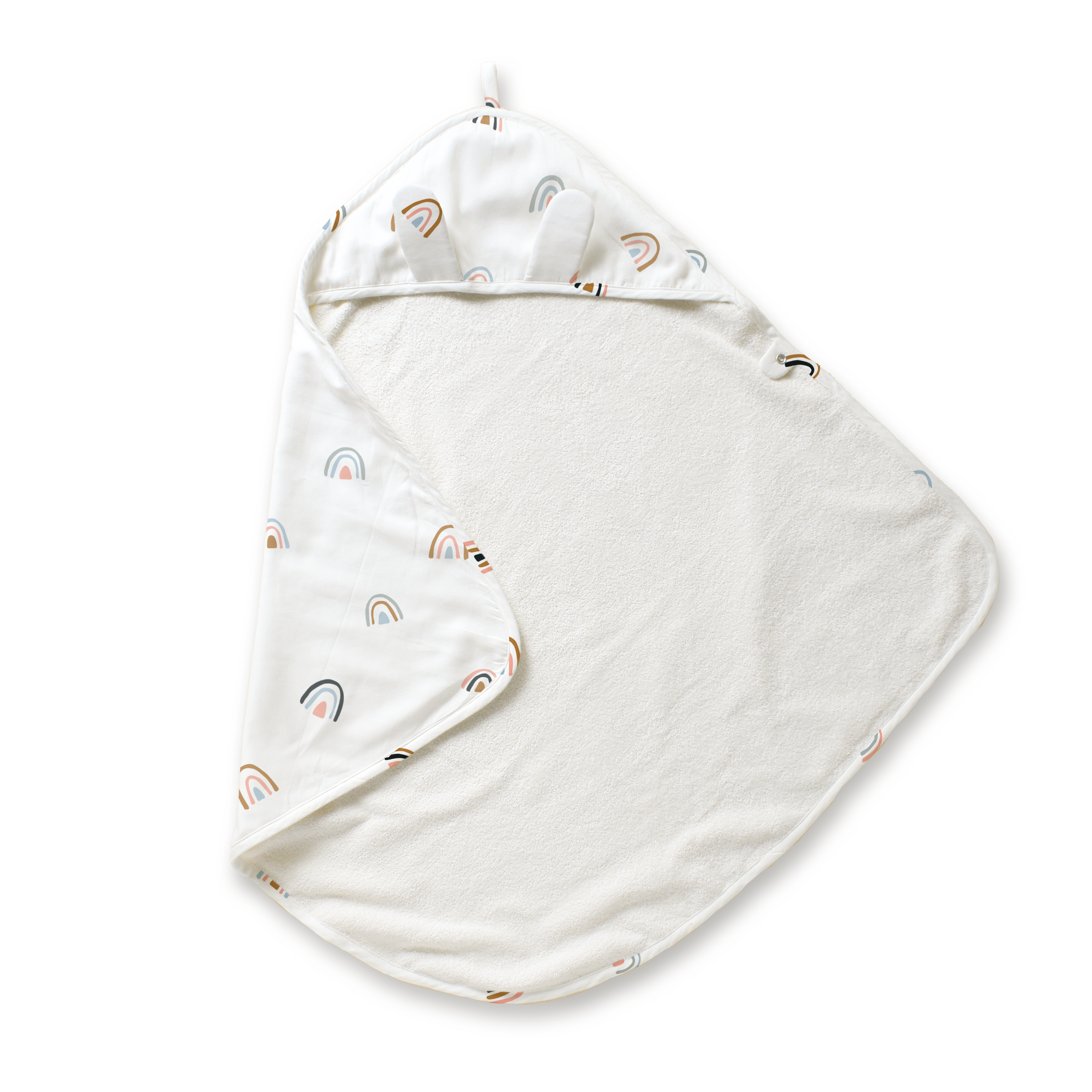 A baby's Makemake Organics Organic Cotton Hooded Baby Towel & Poncho - Rainbow, shaped like a triangle with a hood at one corner. the interior hood lining has a colorful rainbow pattern. the towel is set against a white background.