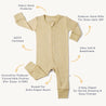 Flat layout image of a beige Organic 2-Way Zip Romper - Yellowstone with polka dots, labeled features like gots certification, fabric neck protector, extra diaper room, and innovative footies suitable for up to 12 months by Organic Baby.