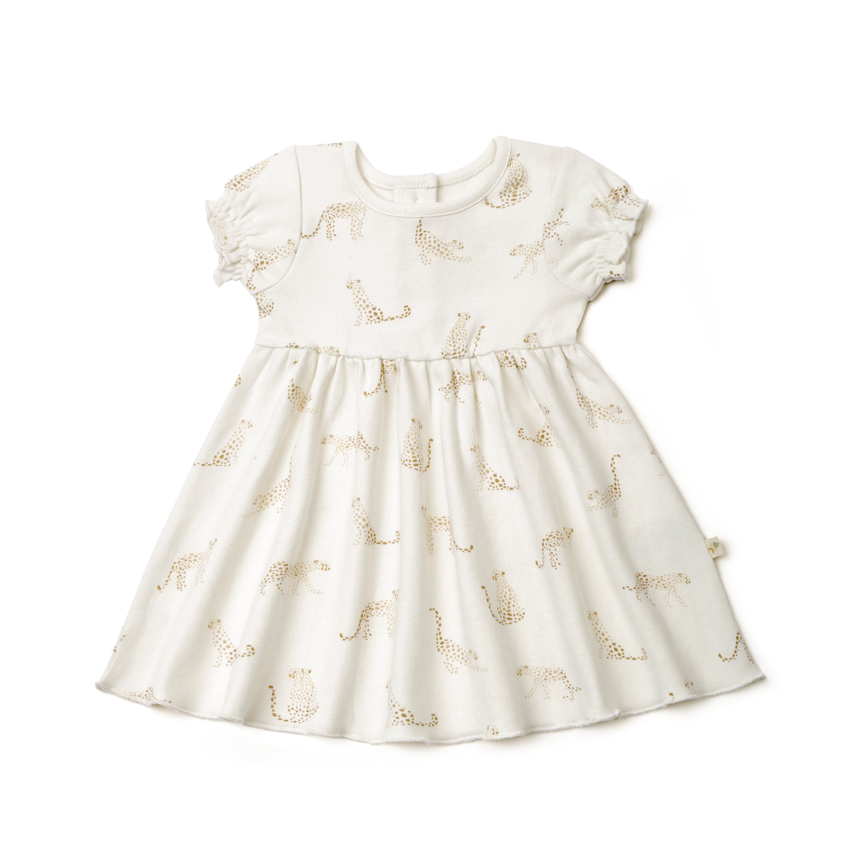 A white toddler dress with short ruffled sleeves and golden giraffe patterns from Organic Kids, displayed against a plain white background.