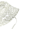A Organic Linen Bucket Sun Hat - Palms with a tropical leaf pattern in white and soft green, isolated on a white background by Makemake Organics.