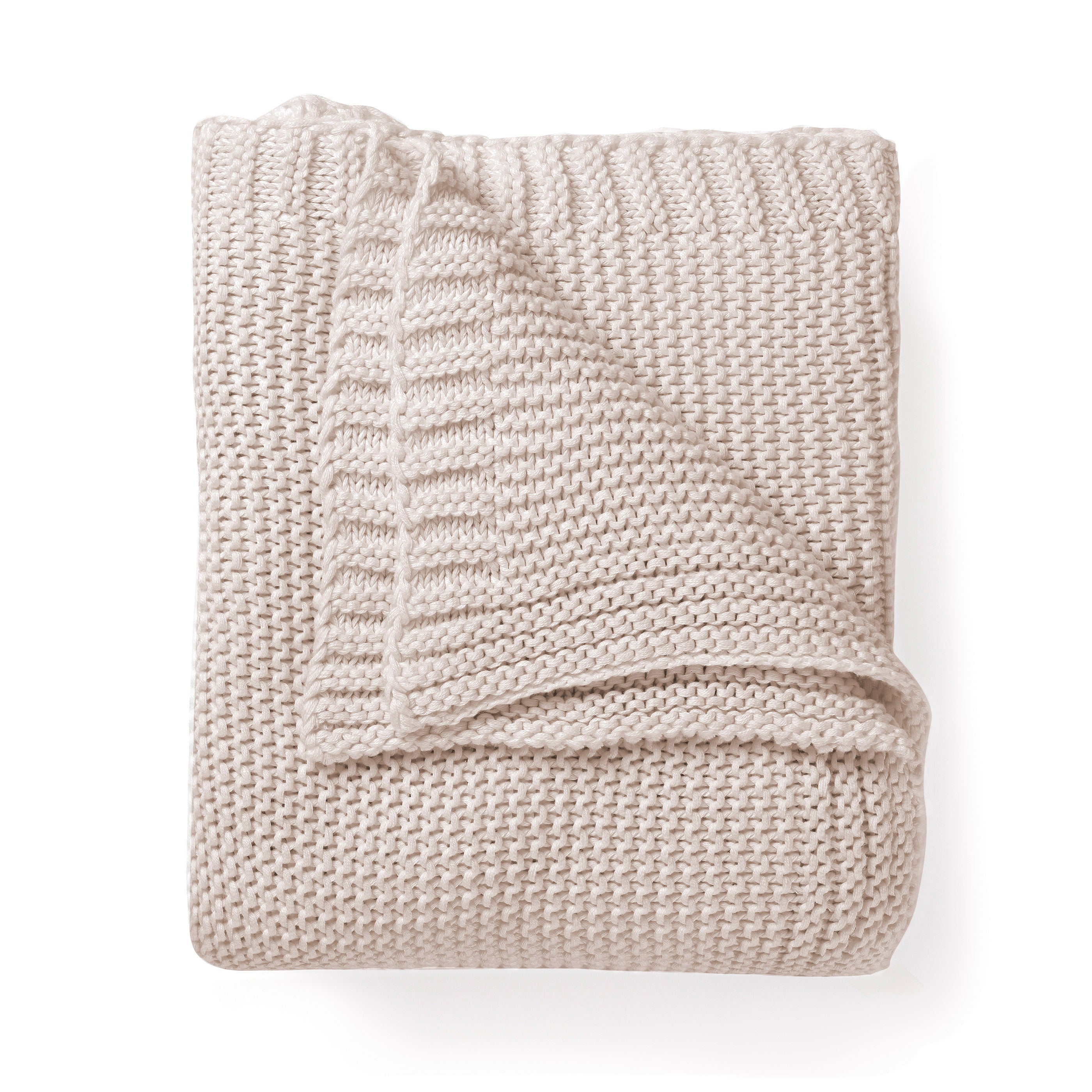 Chunky Knit Throw Blanket - Nora Shell by Makemake Organics neatly folded over itself, isolated on a white background, showcasing its textured weave and cozy appearance.