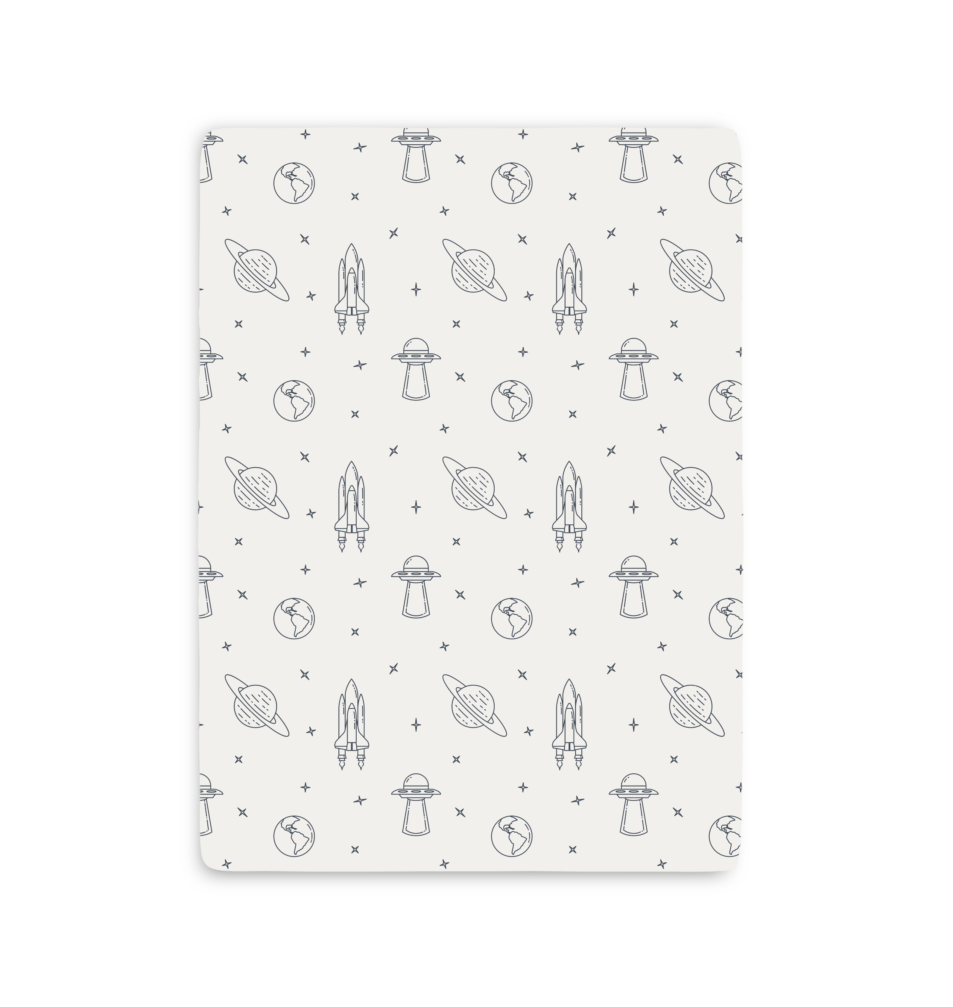A white Mini Crib Fitted Sheet with black and white space drawings from Makemake Organics.