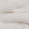 Close-up view of a Chunky Knit Throw Blanket - Ella Ivory showcasing detailed texture and stitch patterns by Makemake Organics.