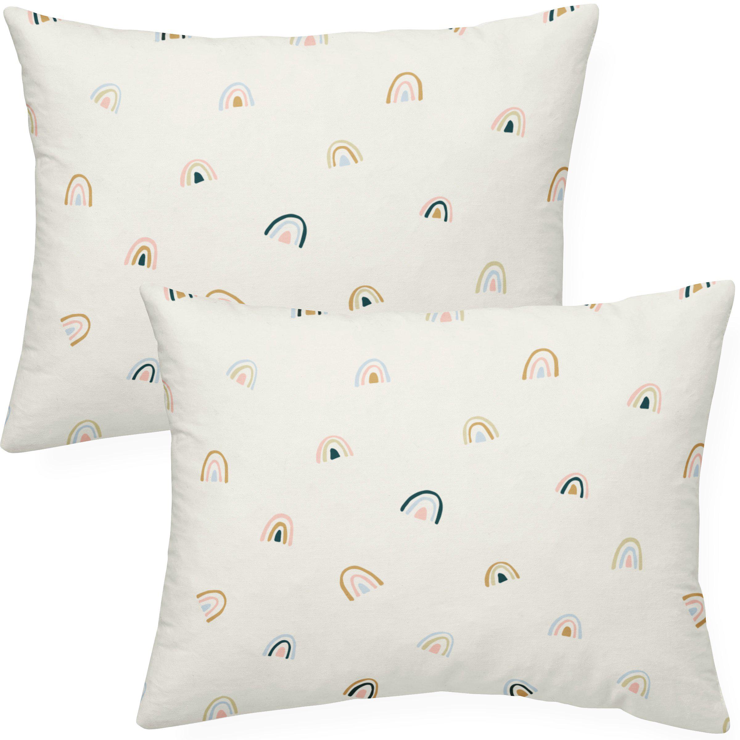 Two rectangular throw pillows with a pattern of pastel-colored, abstract rainbows on a white background. - Makemake Organics Organic Cotton Toddler Pillowcase - Rainbow