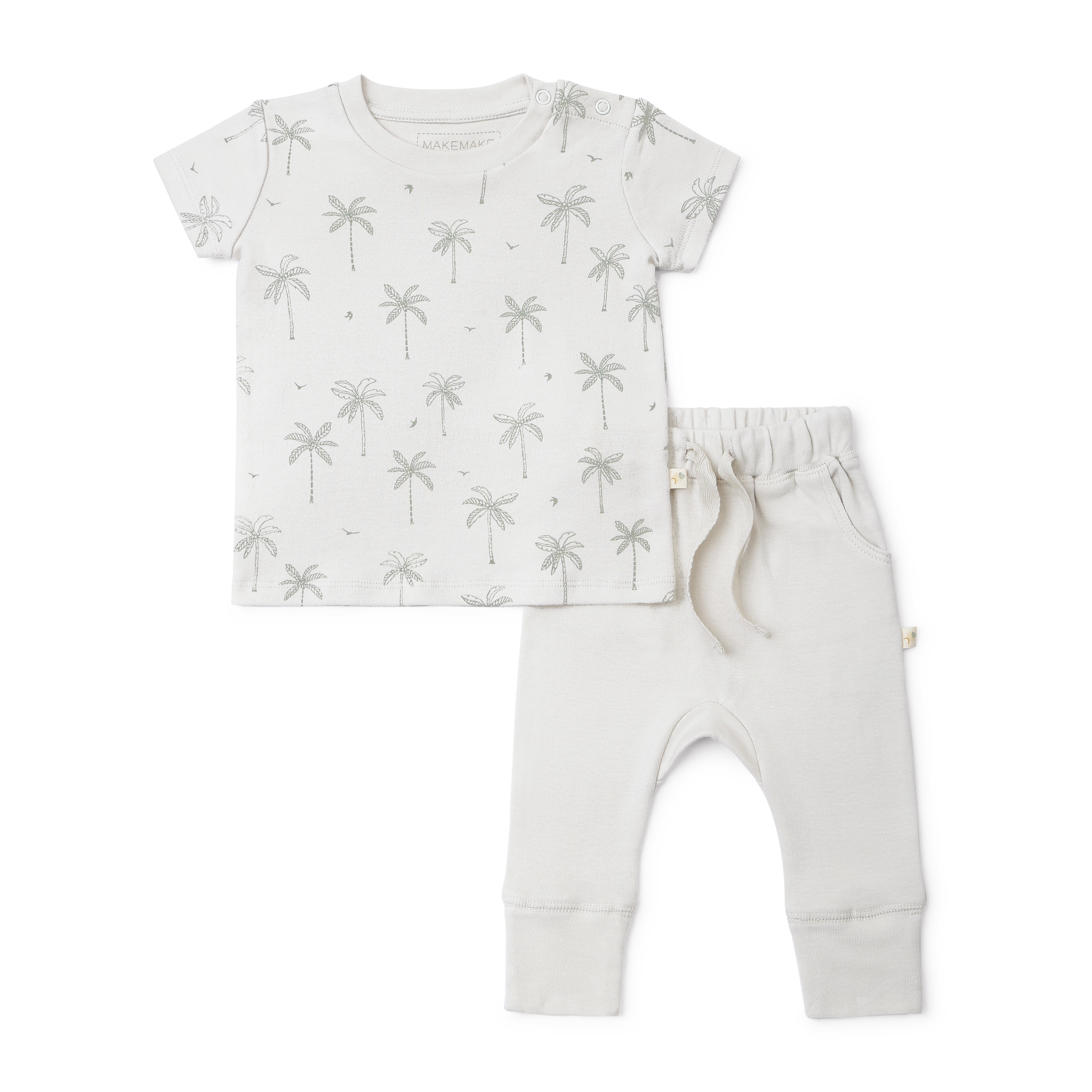 A toddler's outfit from Organic Kids consisting of a white short-sleeve t-shirt with a grey palm tree print and matching plain grey pants with a drawstring waist. The set is Organic Tee & Pants Set - Tropical.