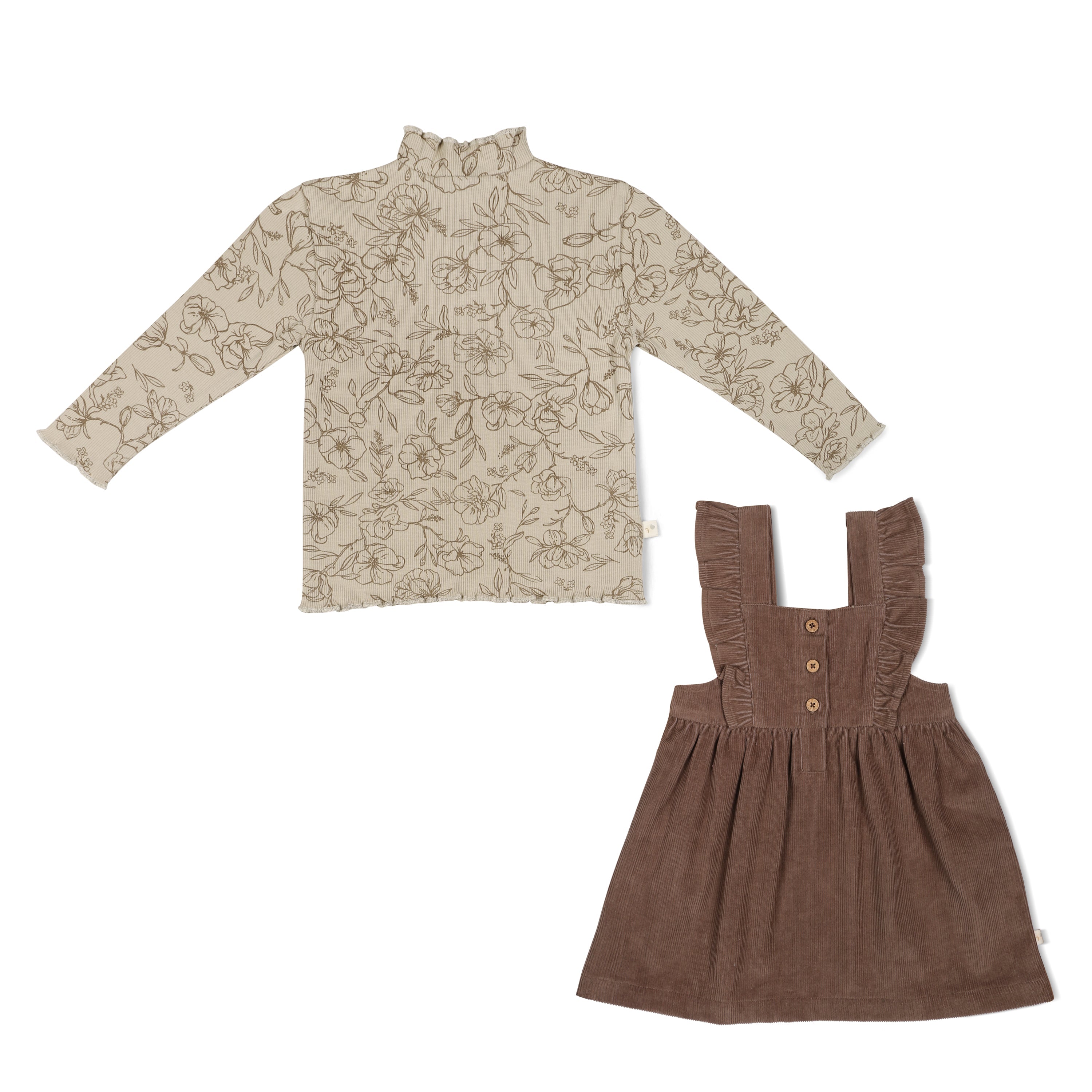 A floral-patterned beige long-sleeve shirt alongside a brown corduroy pinafore dress with ruffled straps.