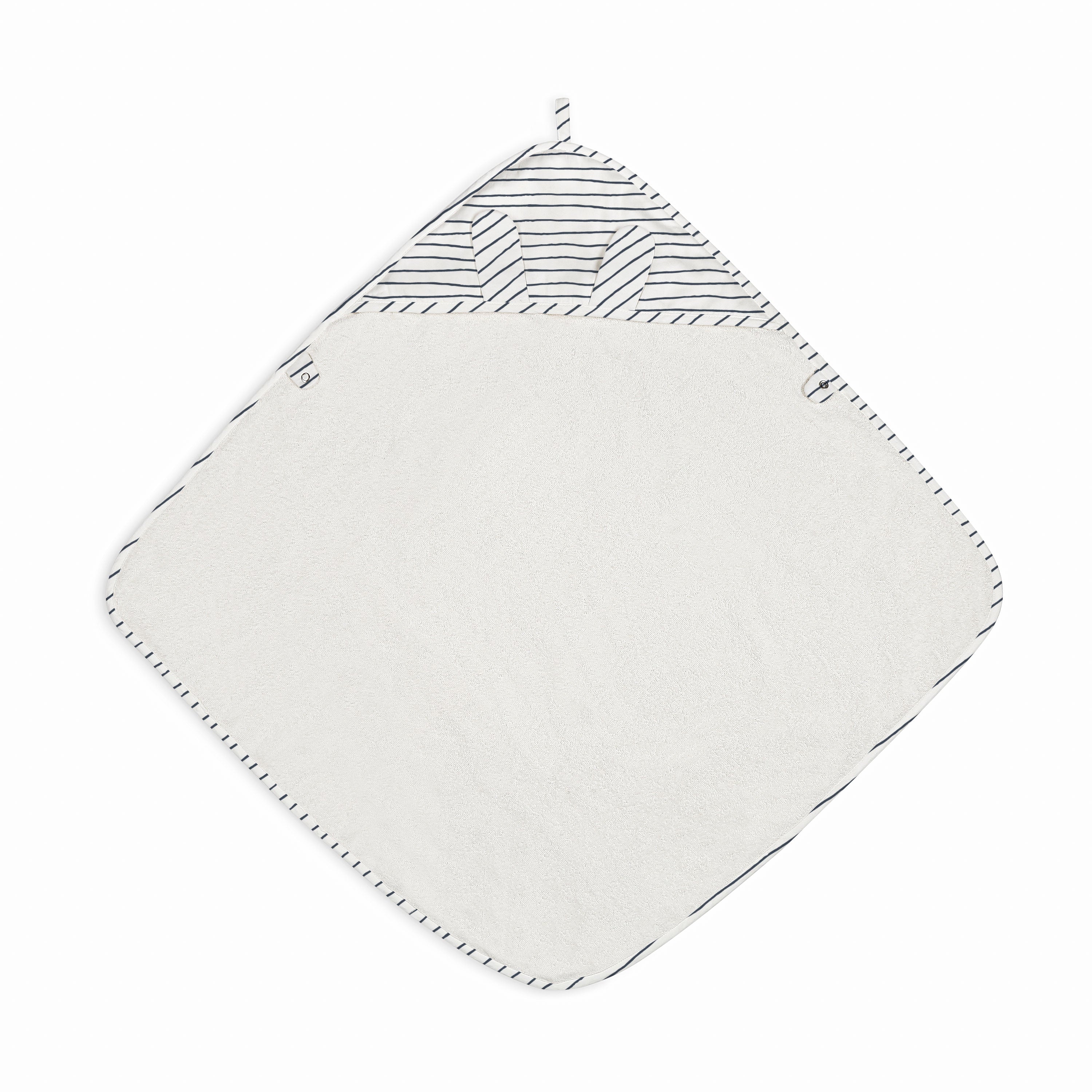 A Makemake Organics Organic Cotton Hooded Baby Towel & Poncho in Navy Stripes with a white, plush surface and black stitched edges, featuring a patterned black and white striped corner with a loop. The background is solid white.
