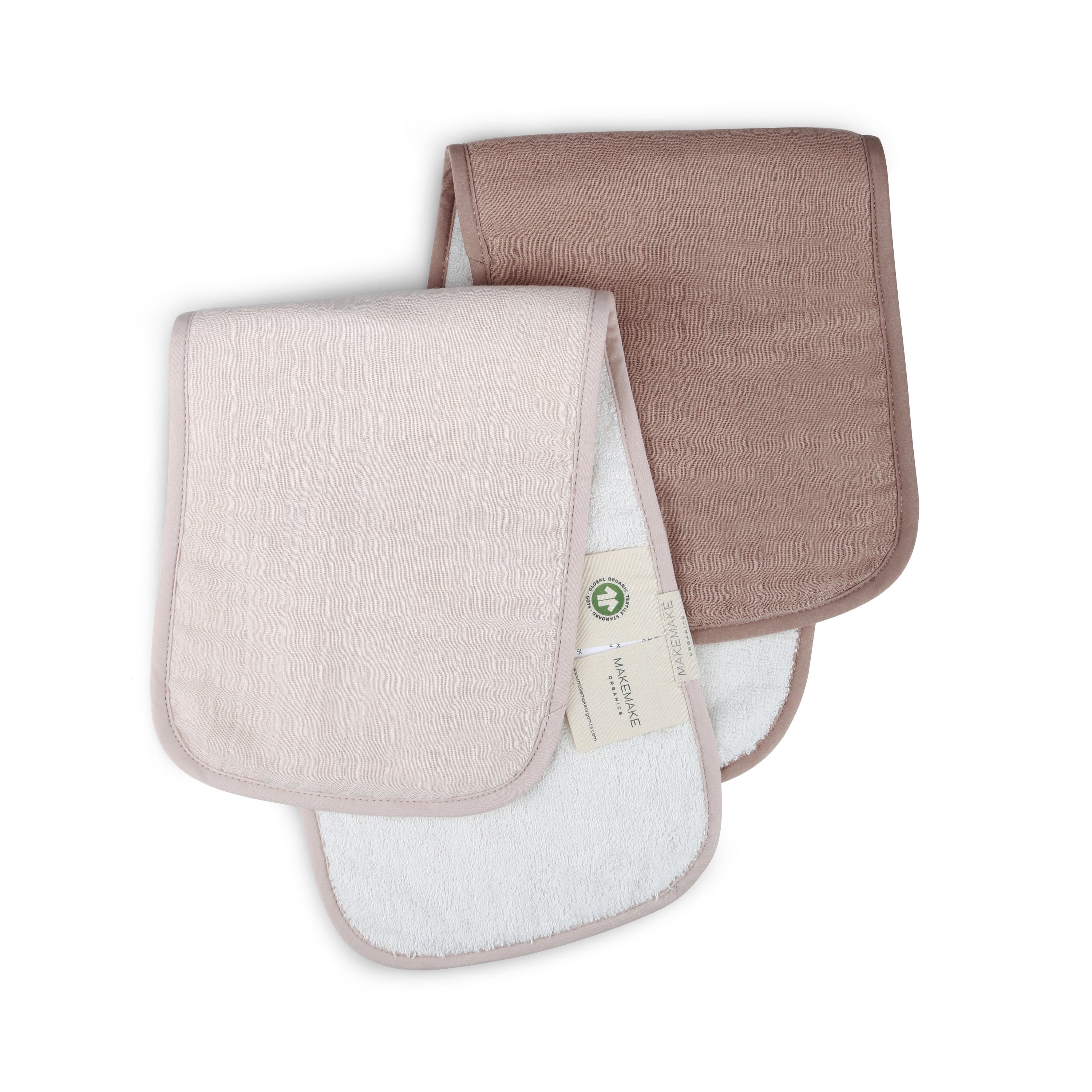 Two rectangular, Makemake Organics Organic Cotton Muslin Burp Cloths in Blush Oat & Pecan, arranged overlapping on a white background. One cloth has a visible label showing it's organic.