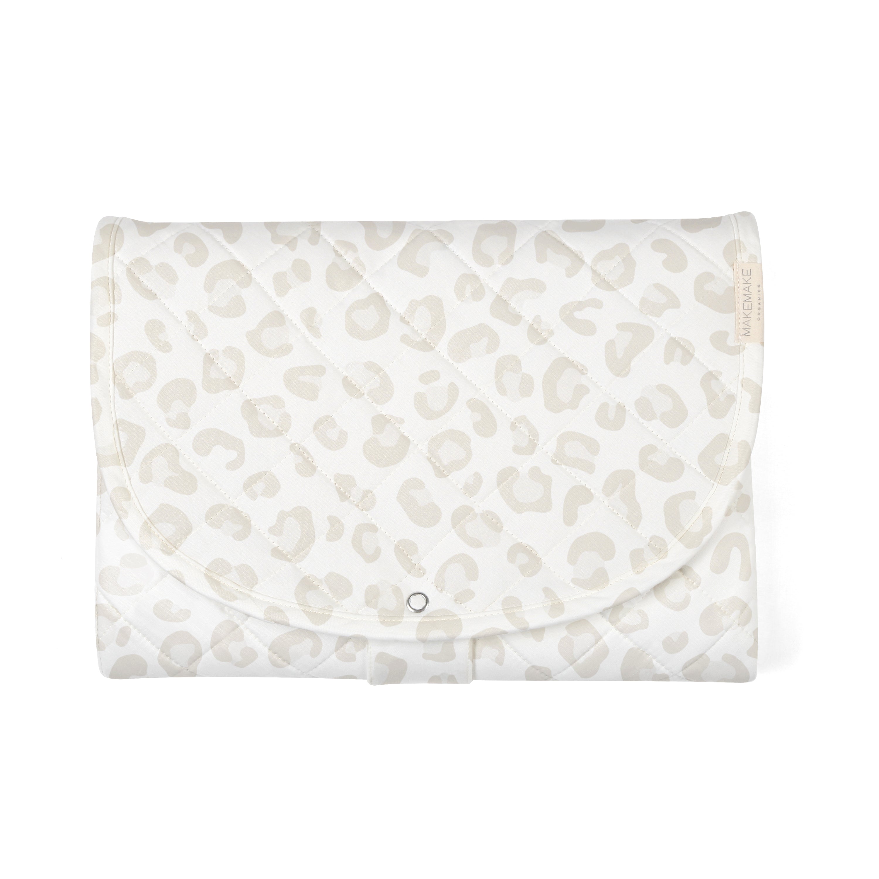A Wild Makemake Organics Organic Cotton Portable Changing Mat with a white and gray leopard print design, featuring a front flap and a silver button closure, displayed against a white background.