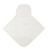 A white baby bib with a subtle leopard heart print pattern spread throughout, featuring a simple snap closure at the neck.
