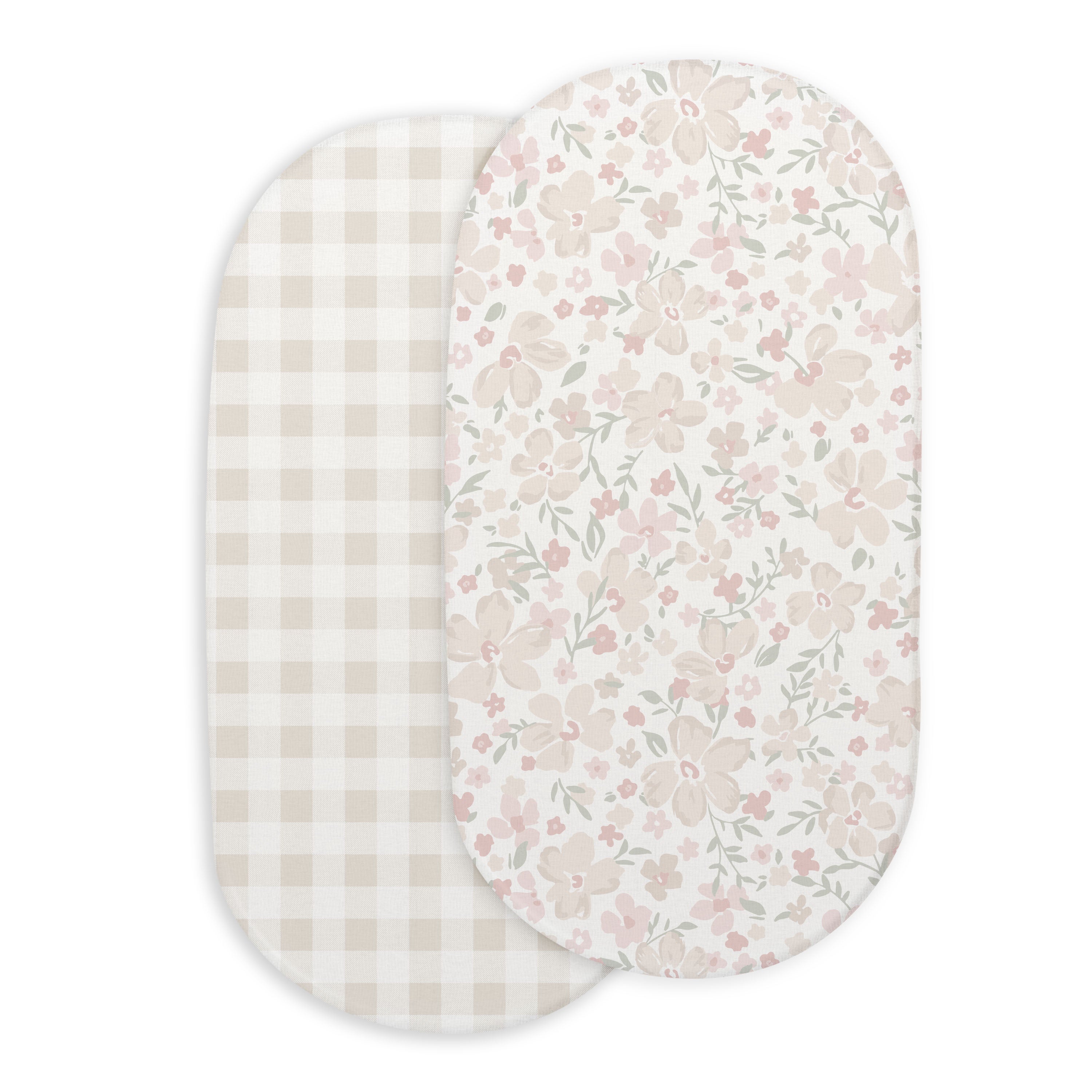 Two oval fabric Bassinet Fitted Sheets from Makemake Organics; one with a beige and white gingham pattern, and the other with a floral pattern featuring pink and green tones.