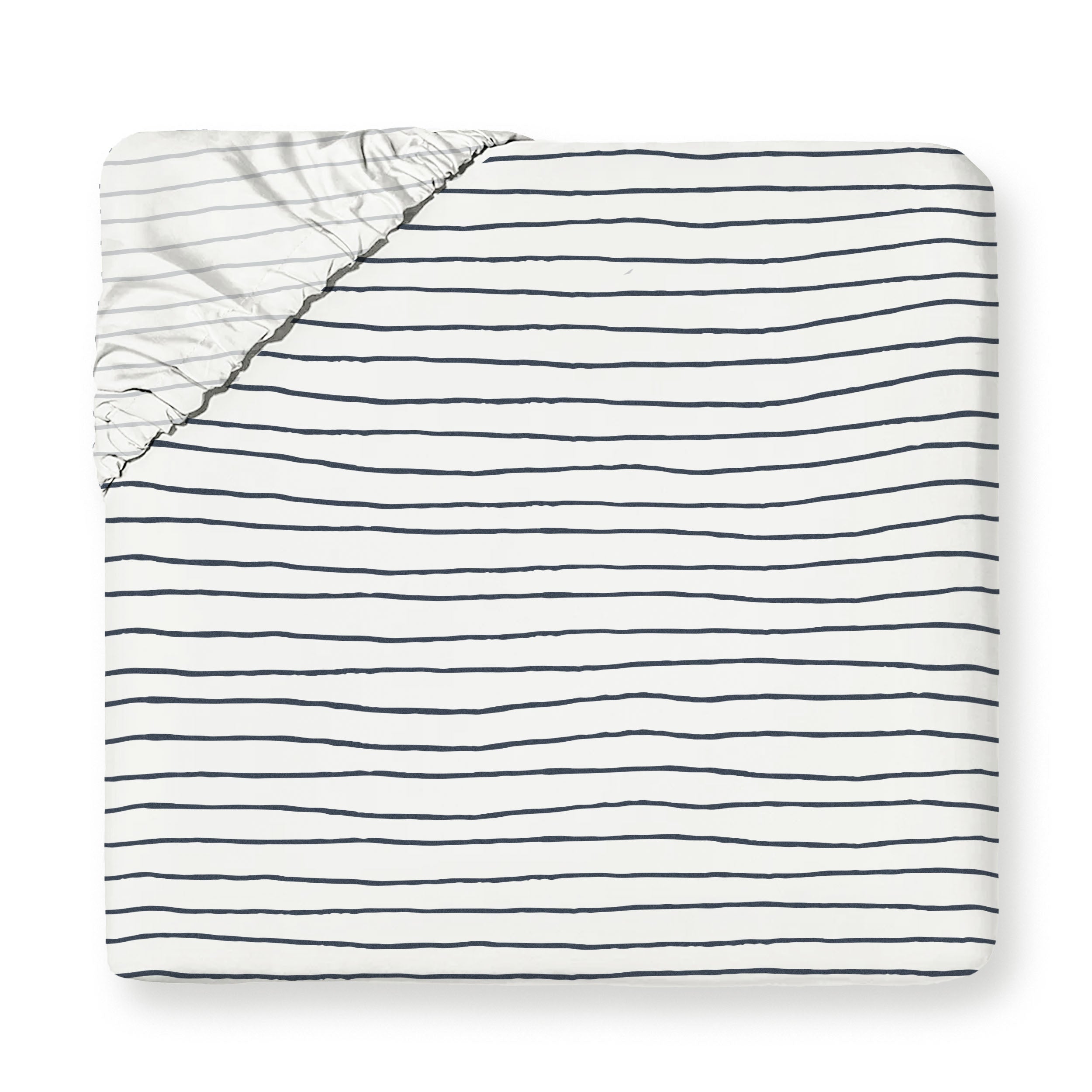 A top view of a neatly folded Organic Cotton Fitted Sheet Set - Navy Stripes from Makemake Organics, with black horizontal stripes on a white background, with one corner slightly unfolded showing the inside.
