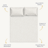 Top view of a plush 300 thread count, sateen, gots certified Makemake Organics Organic Cotton Fitted Sheet Set with a snug elastic fit, featuring a subtle, small geometric pattern. The sheet is described as ultra soft, breathable, and non-toxic.