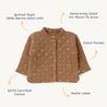 A quilted toddler jacket made of 100% merino wool in a tan color, featuring a front patch pocket, zipper closure, and labeled as Organic Merino Wool Buttoned Jacket - Sparkle by Organic Kids, generously sized.