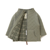 A folded Organic Merino Wool Zip Jacket in olive green with a checkered interior design from Organic Kids. The jacket features a zip and a visible brand label at the neck.