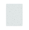 A rectangular white Milky Way notebook cover with a subtle pattern of small black and gray stars scattered across. The background is uniformly pale, creating a clean and simple design by Makemake Organics.