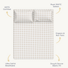 An image of a plush Makemake Organics 300 thread count, gots certified organic sateen bed sheet with a checkered pattern in subtle colors. the sheet is highlighted for its ultra-soft, breathable fabric and snug, secure elastic fit.