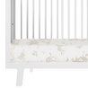 White Makemake Organics baby crib with a Safari crib fitted sheet and pillowcase featuring various animals like deer and birds in a soft, neutral color palette.