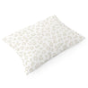 A single rectangular pillow with a pale gray leopard print pattern on a white background, viewed from a slightly elevated angle. - Makemake Organics Organic Cotton Toddler Pillowcase in Wild