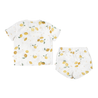 A toddler boy's outfit consisting of a white Organic Linen Top and Shorts 2 Piece Set - Citron, both featuring a lemon print design on a white background from Makemake Organics.