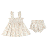 A Makemake Organics Organic Smocked Dress - Summer Floral with shoulder straps and a ruffled skirt, paired with matching bloomers, displayed on a white background. Suitable for a girl.