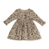 A Organic Kids Organic Long Sleeve Twirl Dress in Woodland beige with a floral and bird print, button details at the neck, and a gathered waist, displayed on a white background.