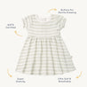 A Organic Kids-certified, soft and breathable baby dress, white with green horizontal stripes, featuring gentle dressing buttons and super stretchy fabric.