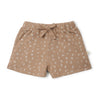 A pair of beige toddler shorts from Organic Kids with a white abstract line pattern and a front tie, displayed on a plain white background.