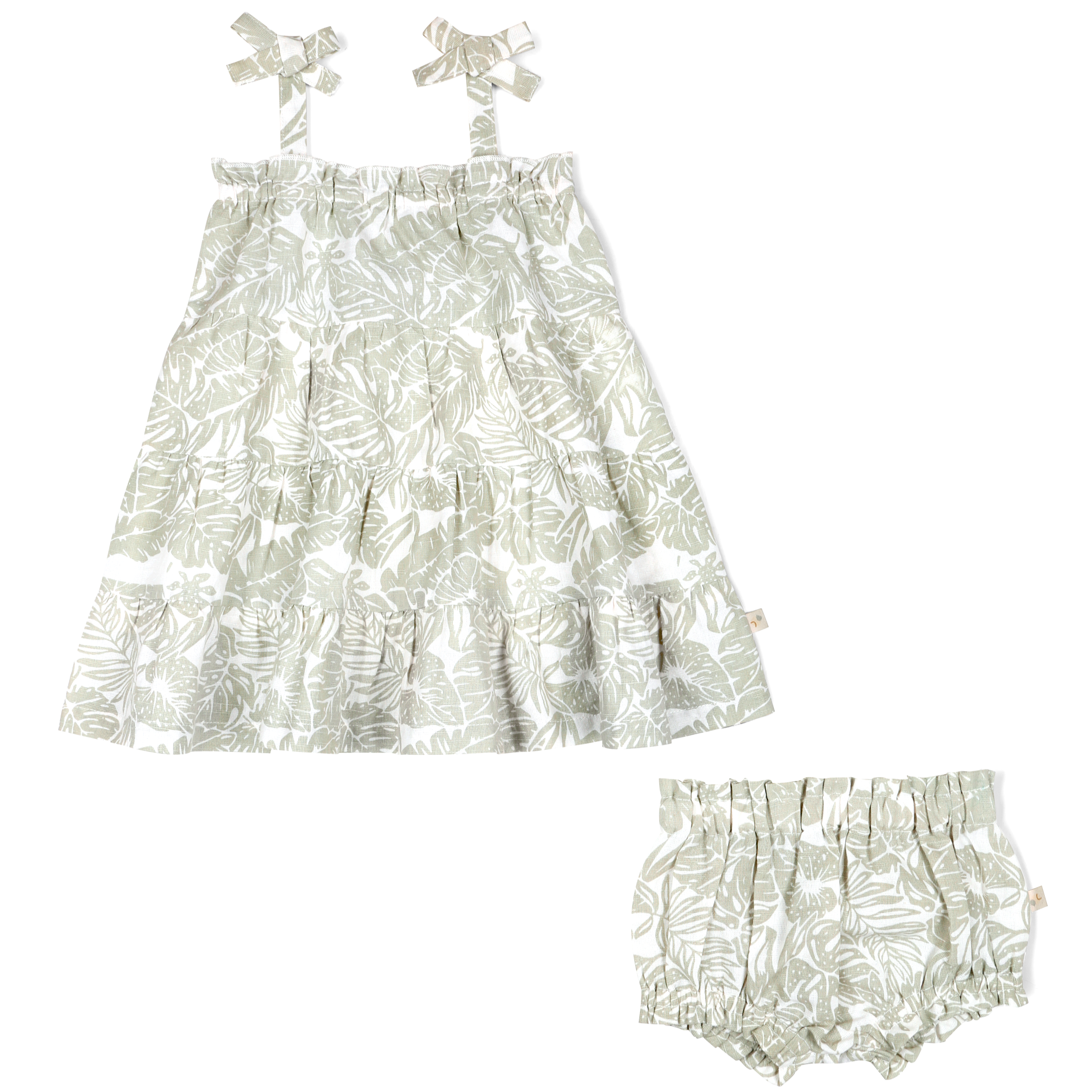 A baby girl's outfit featuring an Organic Linen Tiered Strap Dress in Palms with a matching pair of bloomers and bow-knot hairbands from Makemake Organics, all laid out on a white background.