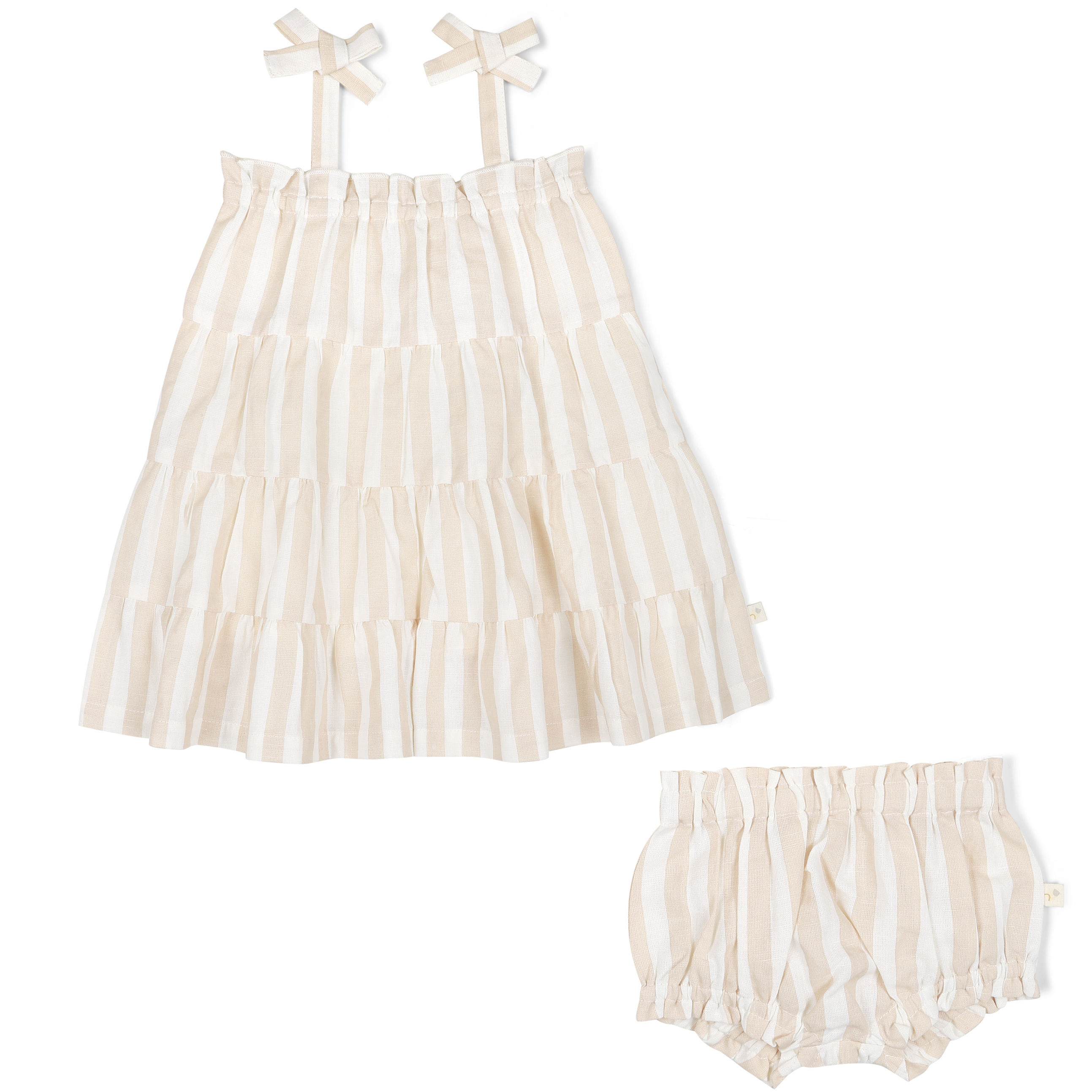 A Organic Linen Tiered Strap Dress - Beige Stripes baby's dress with ruffle tiers, accompanied by matching bloomers and a pair of bow-shaped hair clips, displayed against a white background. Brand Name: Makemake Organics