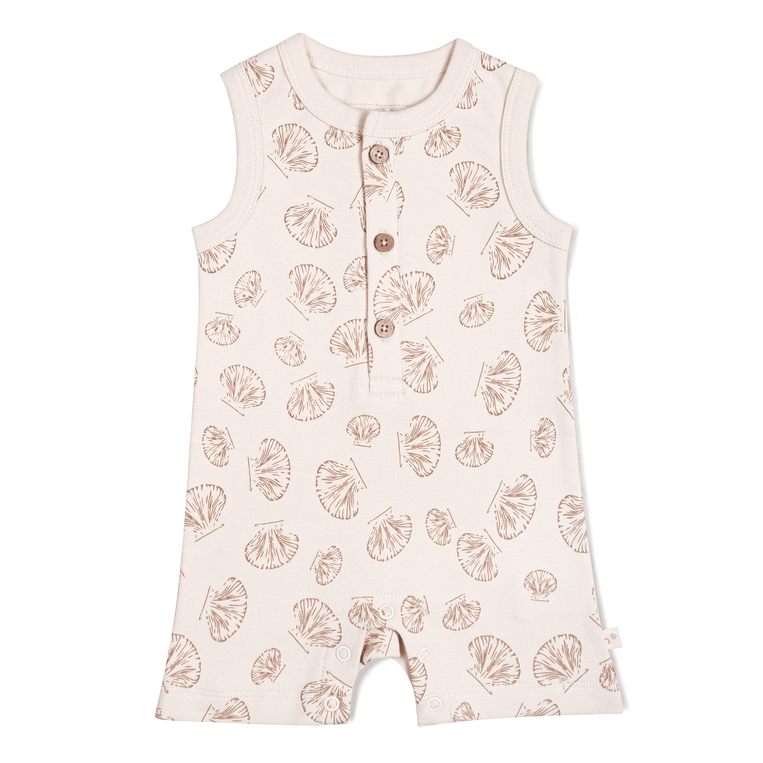 A pale pink Makemake Organics baby girl romper with a pattern of white seashells, featuring sleeveless design and snap buttons at the shoulder and inseam for easy dressing.