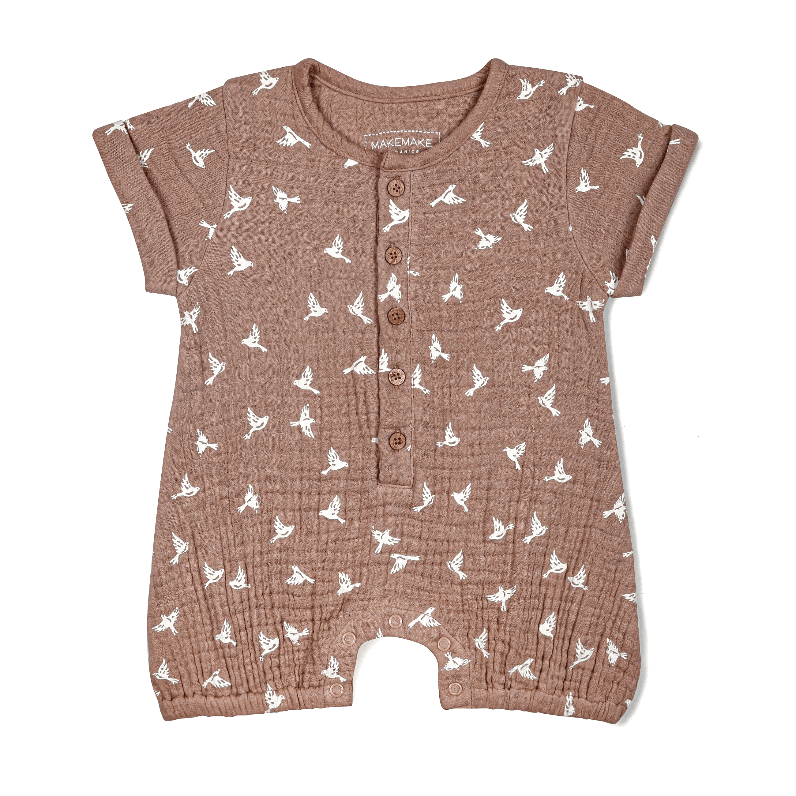 A brown toddler romper with an all-over white bird print, featuring short sleeves, snap buttons down the front and around the legs - Makemake Organics Organic Muslin Short Bubble Romper in Flock design - displayed flat on a white background.
