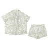 A matching set of light green organic linen Palm print for a toddler boy, consisting of a short-sleeved shirt and shorts, displayed on a white background.