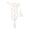 A white Organic Kimono Knotted Sleep Gown - Sunshine with a knotted bottom, featuring a gold star pattern, paired with a matching white hat with a knot top, all isolated on a white background. Made by Makemake Organics.
