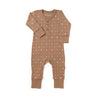An Organic Buttoned Romper - Sparkle in brown with a pattern of small white crosses and stars, featuring button closures at the front and cuffs at the wrists and ankles, displayed on a white background by Organic Baby.