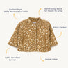 A flat-lay image of an Organic Merino Wool Buttoned Jacket in Wildflower from Organic Kids with floral patterns. Features include 100% merino wool infill, patch pocket, name