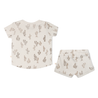 A beige baby outfit featuring a pattern of cacti, consisting of the Organic Tee and Shorties Set - Cactus from Makemake Organics, displayed on a white background.