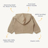 A mocha, oversized hooded jacket from Organic Baby with a large hood, elastic cuffs, and made from 100% GOTS certified cotton, displayed flat from a top-down perspective with descriptive labels.