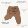 Organic Baby Organic Jogger Pants in Cocoa with an elastic waistband and drawstring, labeled features including GOTS certified cotton, extra room for growth, and soft, breathable fabric. The pants are