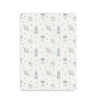 A white Mini Crib Fitted Sheet with black and white space drawings from Makemake Organics.