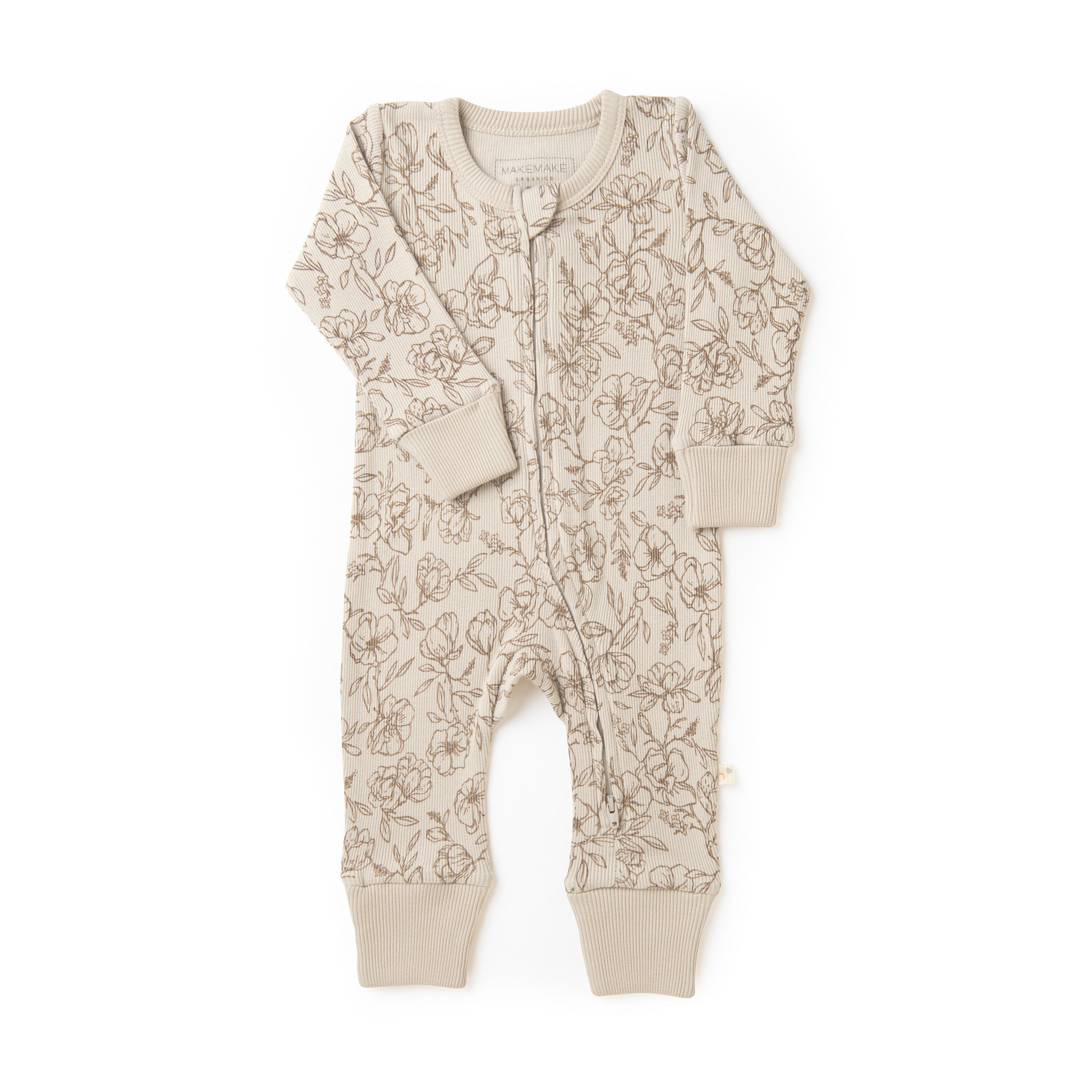 A beige Organic 2-Way Zip Romper - Vintage Bloom with a floral pattern, featuring a button front and ribbed cuffs, displayed on a white background from Organic Baby.