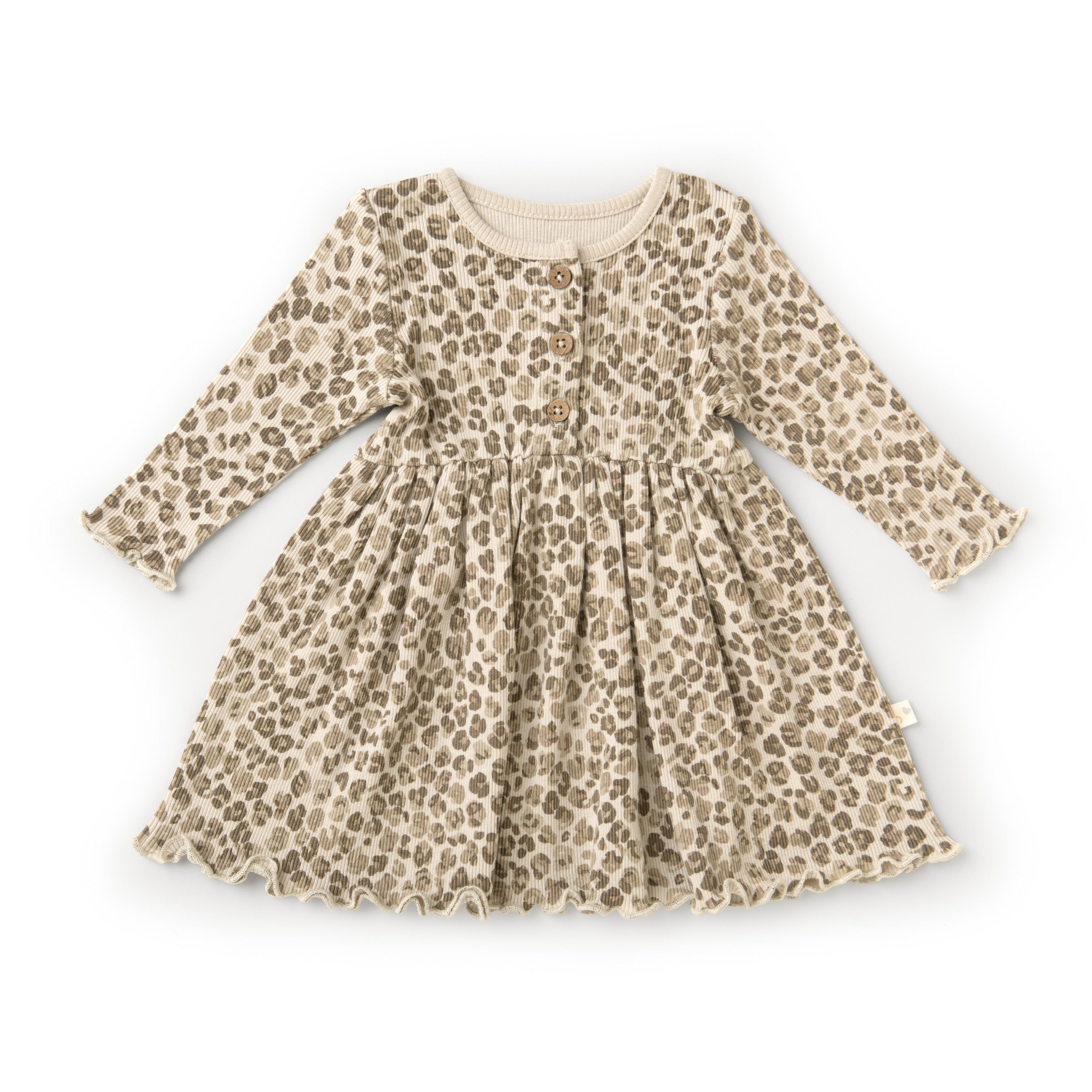 A baby's Organic Long Sleeve Twirl Dress - Spotted from Organic Baby with a leopard print pattern, featuring a round neck and three decorative buttons at the chest, laid flat on a white background.