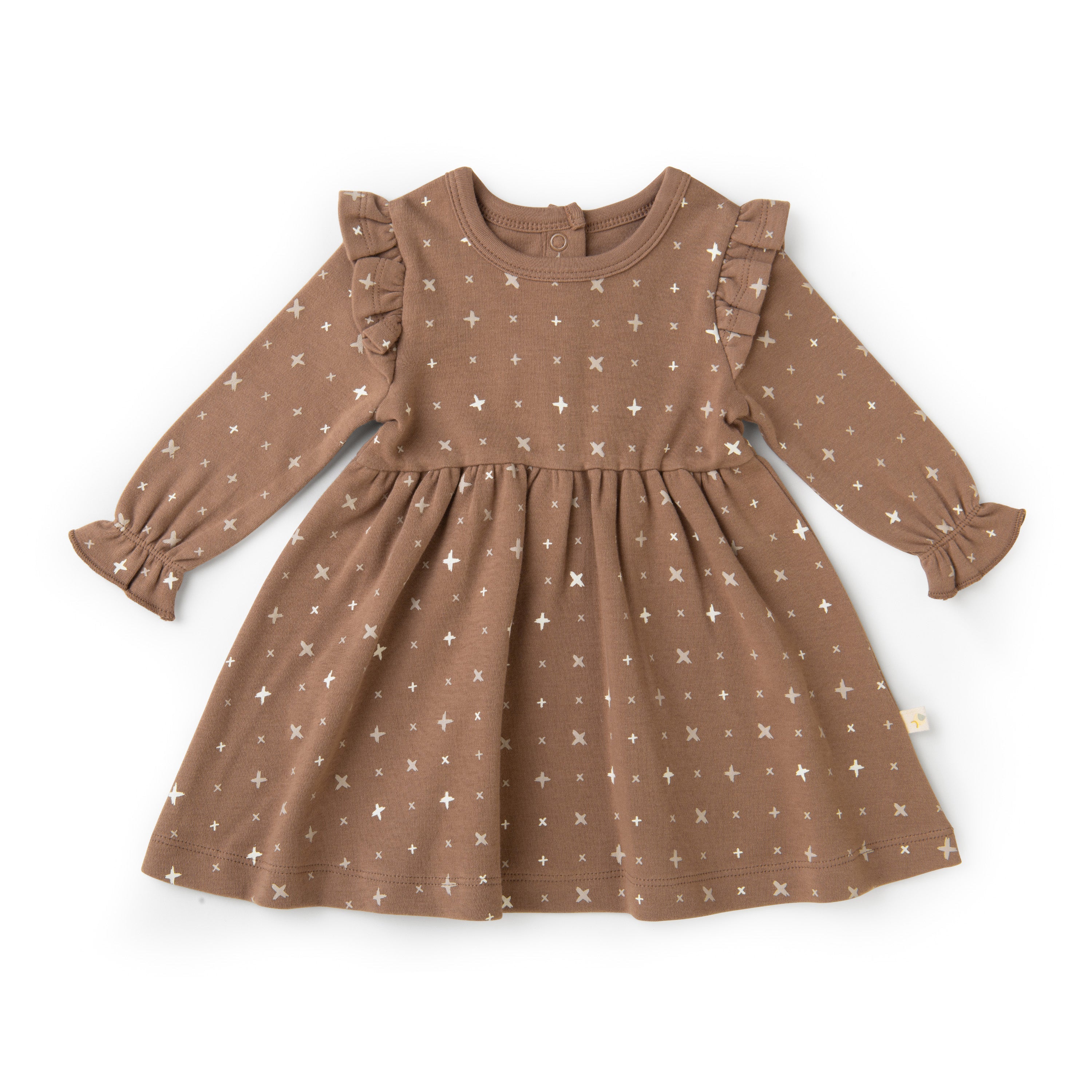An Organic Ruffle Dress - Sparkle from Organic Girls with white cross patterns, featuring frilled shoulder details and long sleeves, displayed on a white background.
