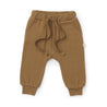 A pair of Organic Jogger Pants - Tan from Organic Baby with an elastic waistband and drawstring, displayed on a white background.
