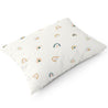 A white rectangular pillow decorated with a pattern of colorful, stylized rainbows, isolated on a white background - Makemake Organics Organic Cotton Toddler Pillowcase - Rainbow.