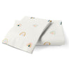 Two folded white towels with a colorful Organic Cotton Toddler Pillowcase - Rainbow pattern, displayed on a plain white background from Makemake Organics.